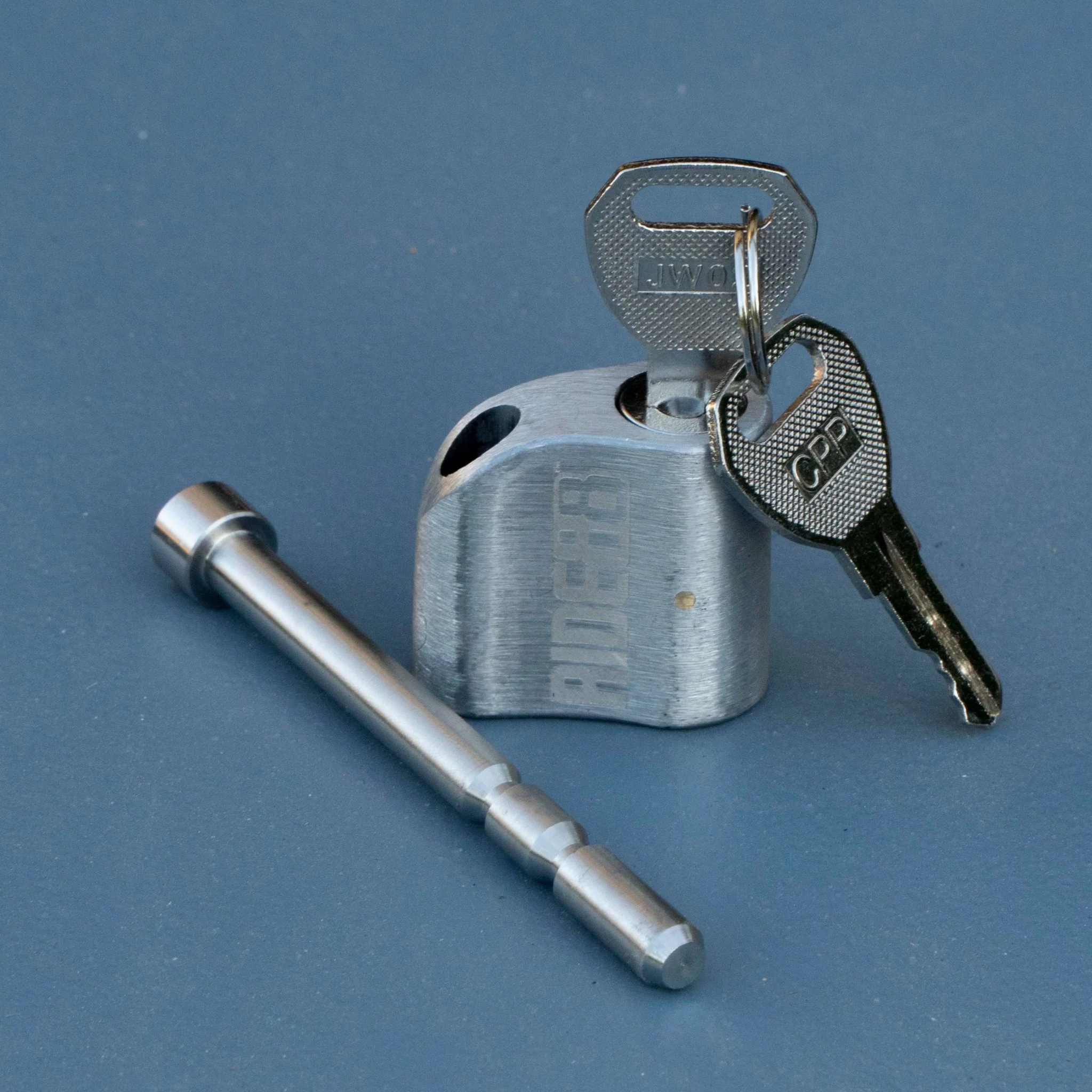 RIDE88 stainless steel locking pin and key set for securing QR3 Bike Rack and Telescopic Crossbar, precision-machined for truck bed bike rack security.