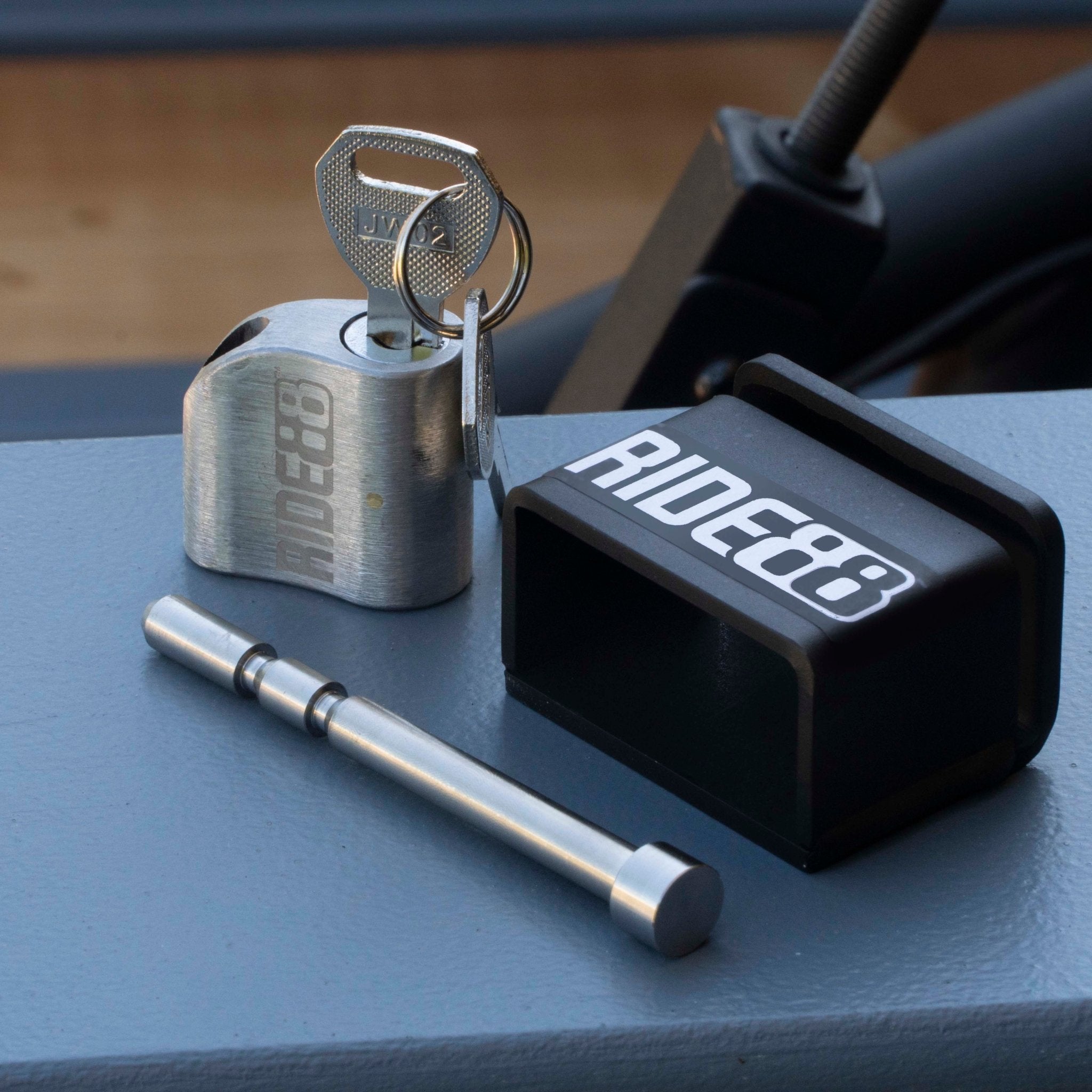 RIDE88 stainless steel locking pin, key, and steel lock-housing set for securing QR3 Bike Rack, precision-machined for truck bed bike rack security.