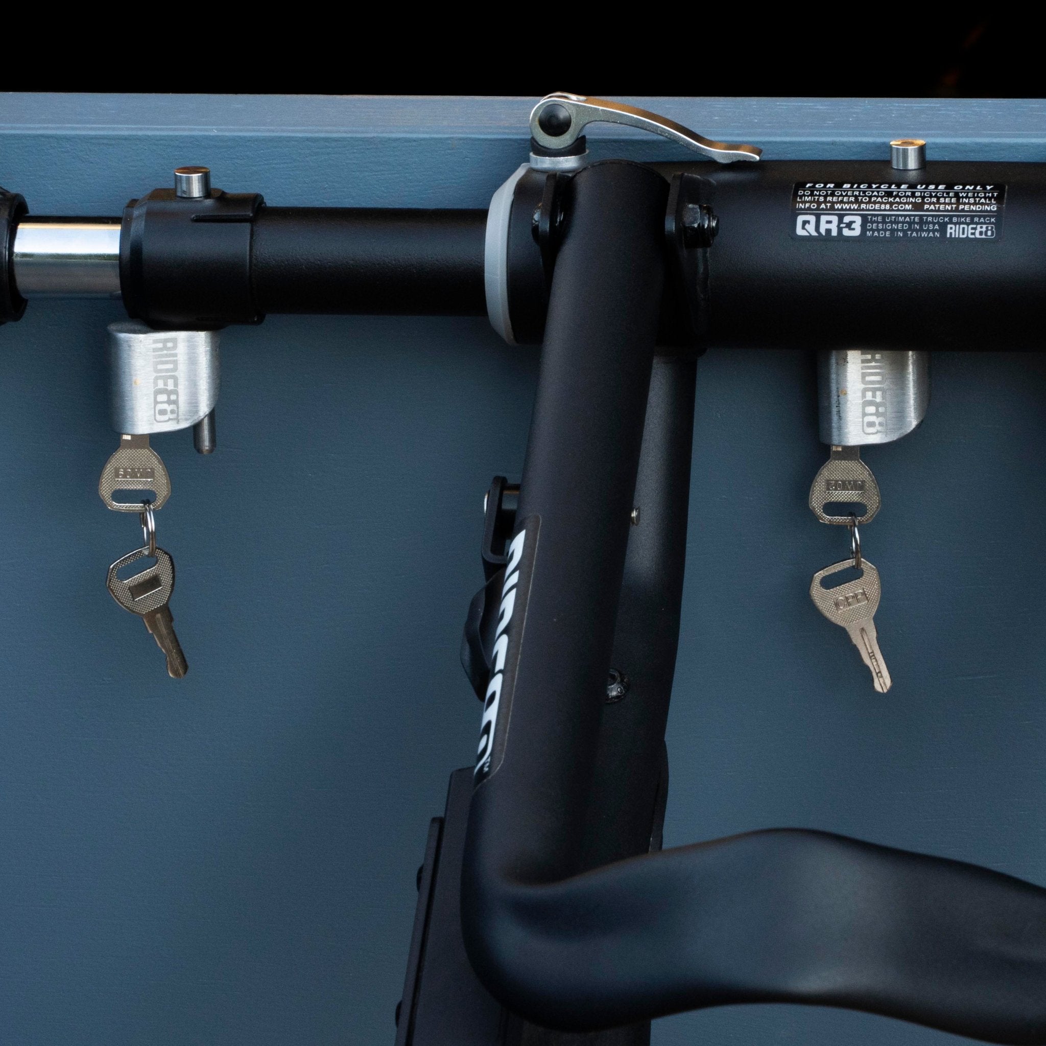 RIDE88 Universal locks locking both the QR3 Bike Rack and Telescopic Crossbar.