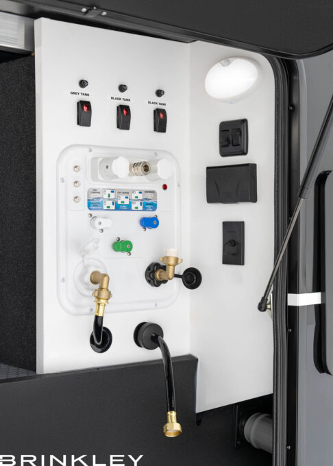 Fifth Wheel Toy Hauler Docking Utility Center with Electric Dump Valves & Retractable 65' Water Hose.