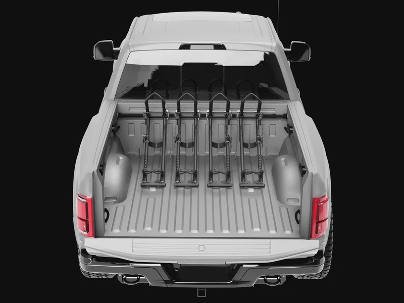 A truck bed showing multiple QR3 bike racks being added and their ability to move left to right for best placement.