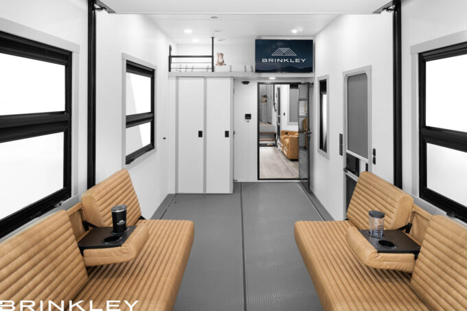 Interior view of Brinkley Model G garage sofas with armrests and cupholders in use.